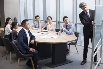 Business people having meeting in board room