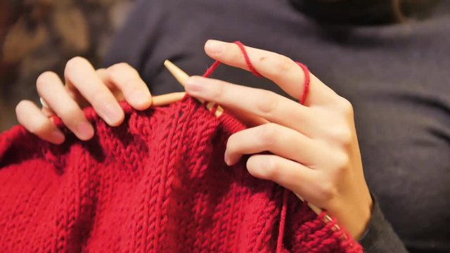 woman hands doing knitting Close-up shot