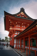 Haiden is hall of worship or oratory. Japanese traditional temple or shrine with golden red roof in Fushimi Inari shrine, Kyoto, Japan