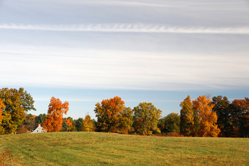 village farm house and autumn farmland