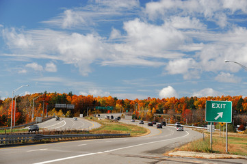 winding highway and colorful autumn mountain under sunny sky