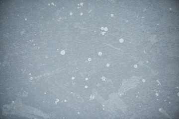 White splash on gray background concrete wall, messy, splotchy, surface.