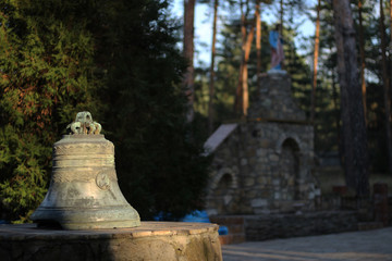 The old church bell on a pedestal