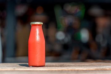 Raw grapefruit juice in glass bottle