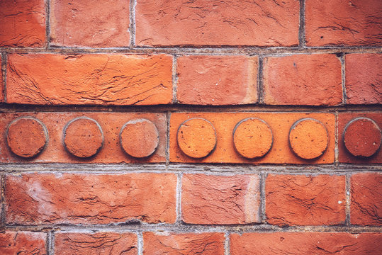 Textured background of bright brick wall