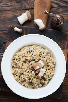 Porcini risotto served in a glass plate, view from above