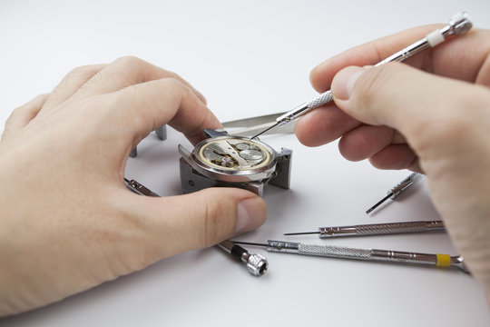 Chinese watchmaker repairing a wristwatch