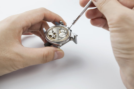 Chinese watchmaker repairing a wristwatch