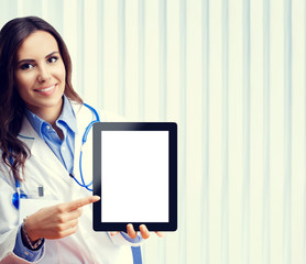 Doctor showing blank tablet pc for copyspace