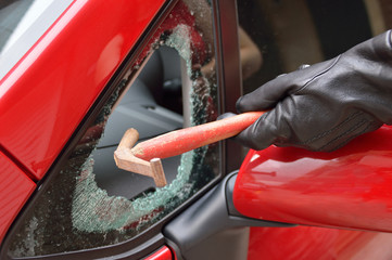 thief stealing a car