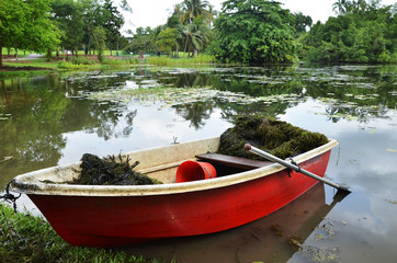 Naklejka na ściany i meble Red boat in Singapore Botanic Garden