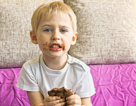 Boy Eating Chocolate,  Face Blurred In Chocolate