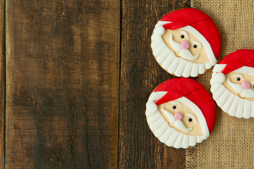 Obraz na płótnie Canvas Delicious Christmas cookies with Santa Claus face