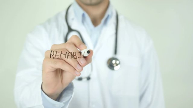 Rehabilitate , Doctor Writing On Transparent Screen
