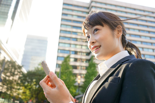fresh business woman looking up with smile