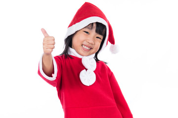 Happy Asian Chinese little santa claus girl with thumbs up