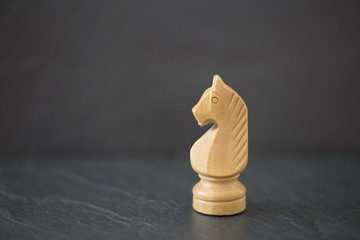 A single white chess knight