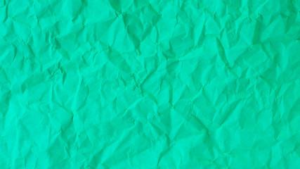 green creased paper for a background texture.
