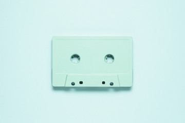 Retro wave / Creative photo of  painted cassette on mint background.