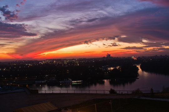 Dramatic colorful sunset over confluence of Danube and Sava river in Belgrade, Serbia