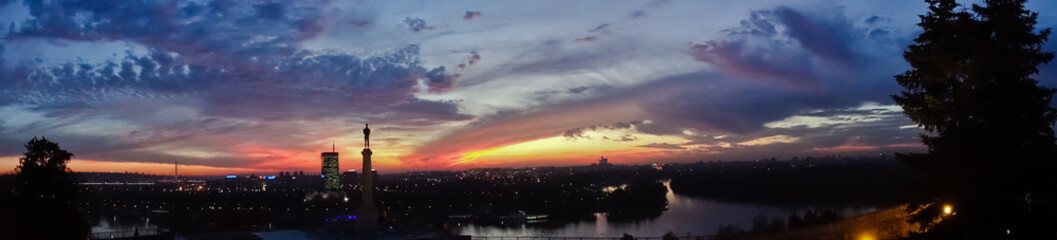 Dramatic colorful sunset over confluence of Danube and Sava river in Belgrade, Serbia