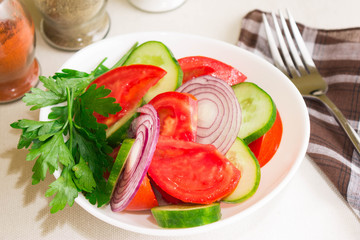 Salad with cucumbers and tomatoes