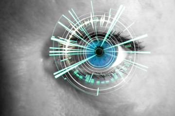 Eye of a woman with digital interface in front of it