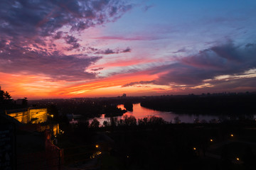 Dramatic colorful sunset over confluence of Danube and Sava river in Belgrade, Serbia