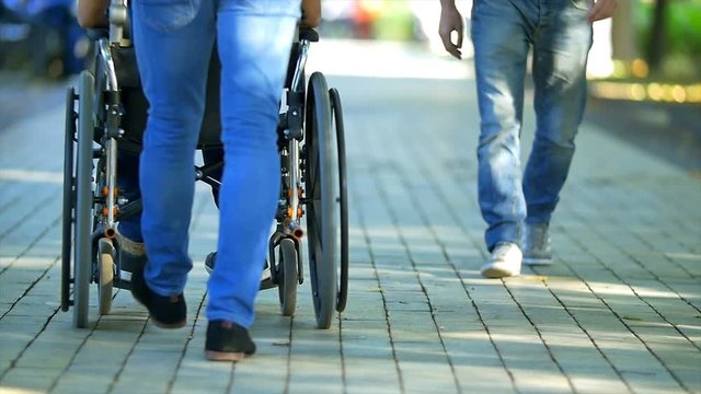 3 in 1 video! The man walk with a disabled on the street. Slow motion