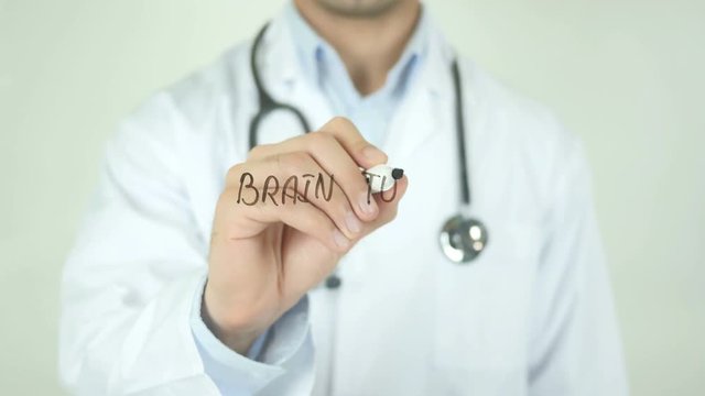 Brain Tumor  , Doctor Writing On Transparent Screen