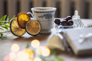 Enjoying a cup of coffee while wrapping gifts