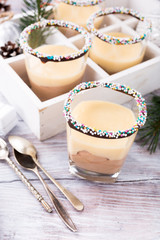 Chocolate dessert with Custard cream. Delicious Christmas themed dinner table.