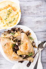 Delicious Christmas themed dinner table with roasted chicken, appetizers and desserts. Top view. Holiday concept. Copy space.