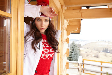 woman resting after a winter sports on the terrace of the resort