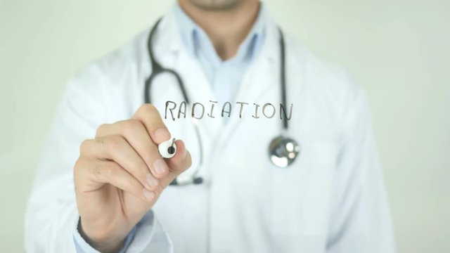 Radiation therapy , Doctor Writing On Transparent Screen