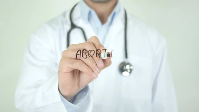 Abortion , Doctor Writing On Transparent Screen