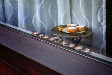 Nine-branched mehorah Hanukiah in the window