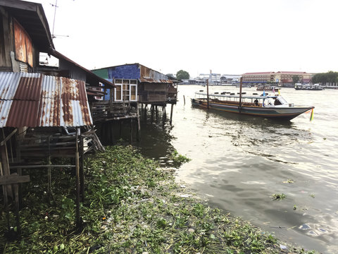 The Water Pollution Ploblems, the Slums and the long tail Boat i