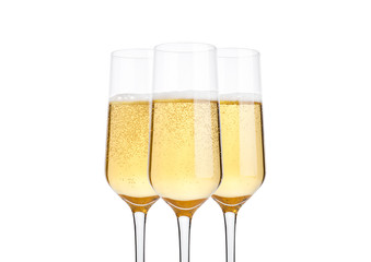 Glasses of champagne with bubbles on white