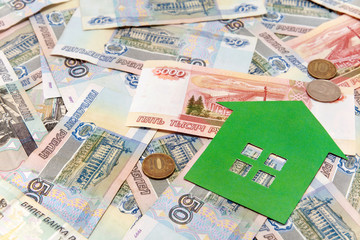 Green paper house and a lot of Russian money