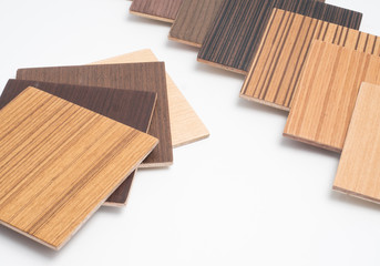 Naklejka na ściany i meble Samples of veneer wood on white background. interior design select material for idea. 