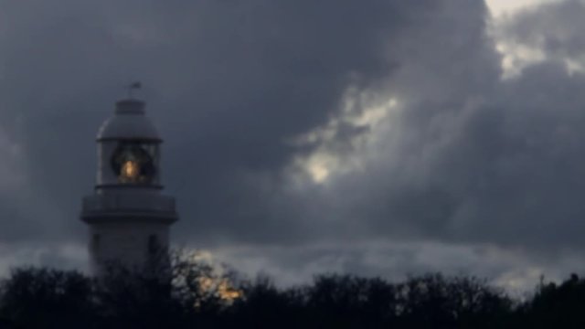 WS Light circling in lighthouse against dark sky