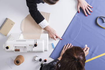 Two women working at pattern together