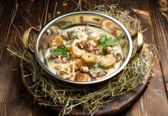 potatoes with chunks of meat in a creamy sauce