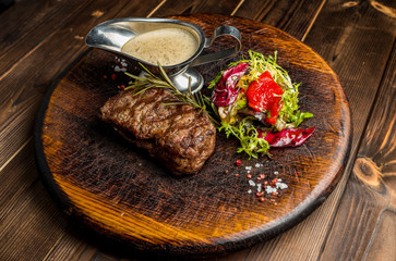 steak sauce with a piece on the board