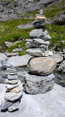 cairns used as trail markers along the hiking paths in the Swiss Alps