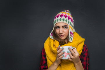 Woman holding cup of tea 
