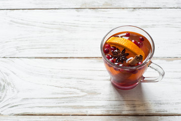 Cup of hot tea with fruit and spices.