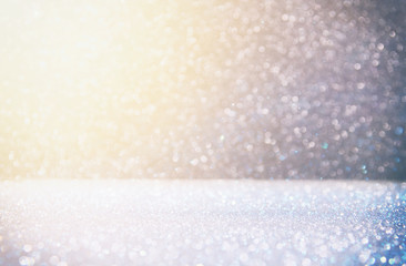 glitter vintage lights background. silver, gold and blue