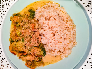 Asian meal with chicken and vegetables cooked in wok pan